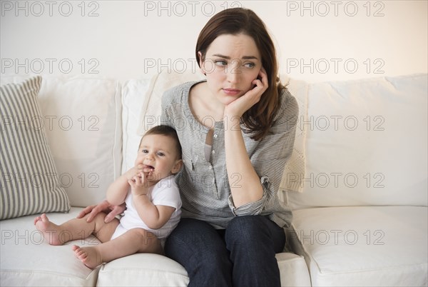 Mother with new baby suffering from postpartum depression