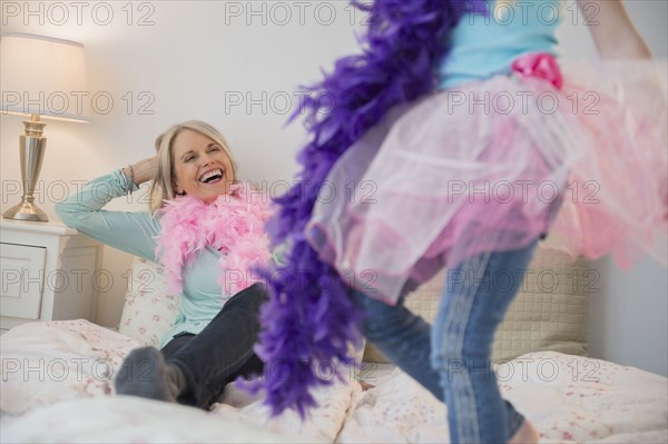 Senior Caucasian woman and granddaughter playing dress up