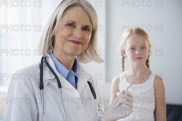 Caucasian doctor taking patient's temperature