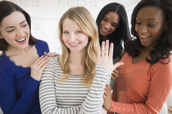 Woman showing off engagement ring