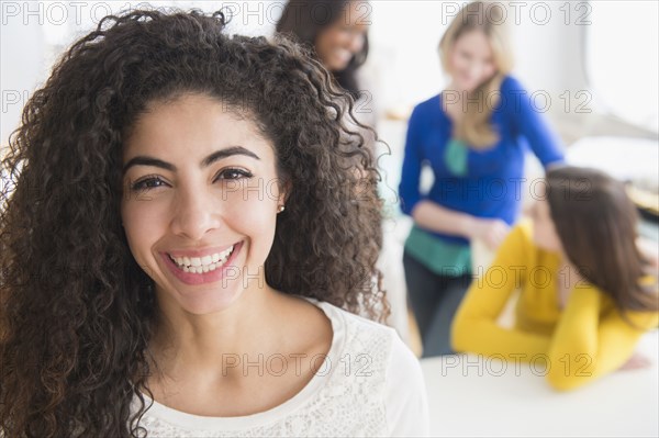 Woman smiling in living room