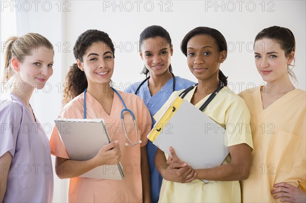 Nurses smiling together in hospital