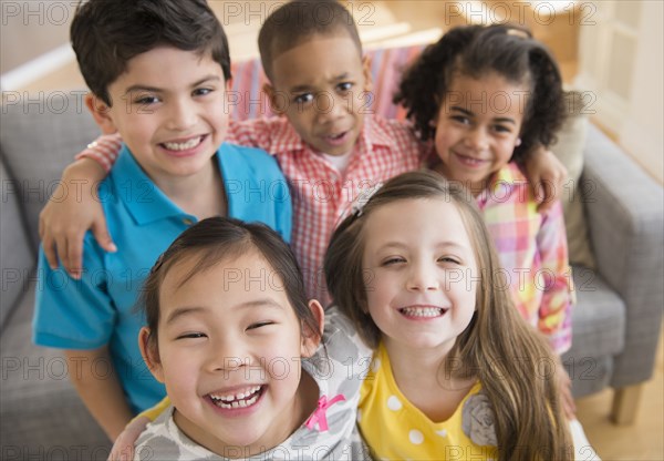 Children smiling together in living room