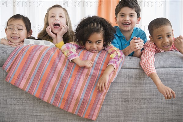 Children playing on sofa