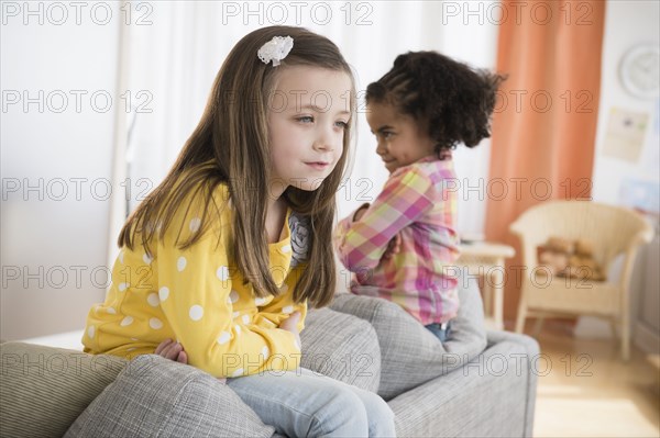 Girls fighting on sofa