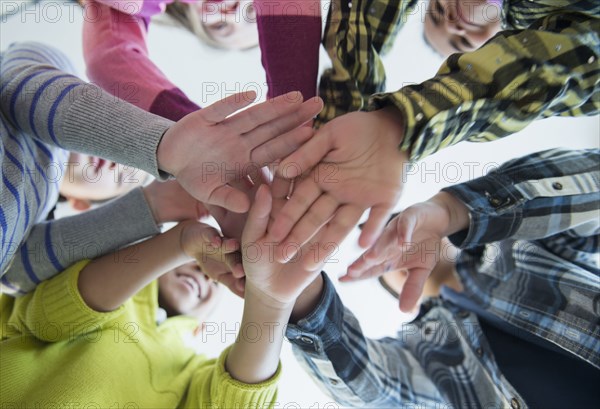 Children cheering in huddle