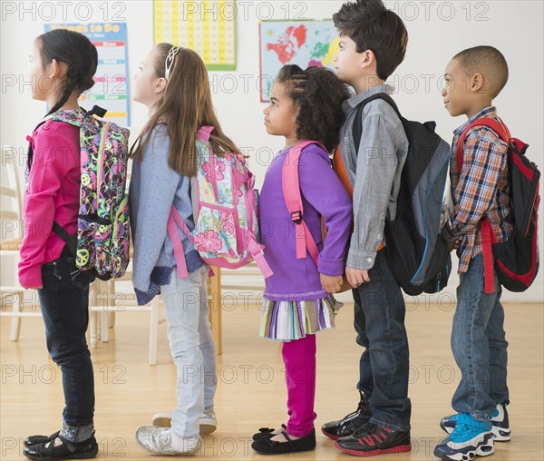 Students standing in line in classroom