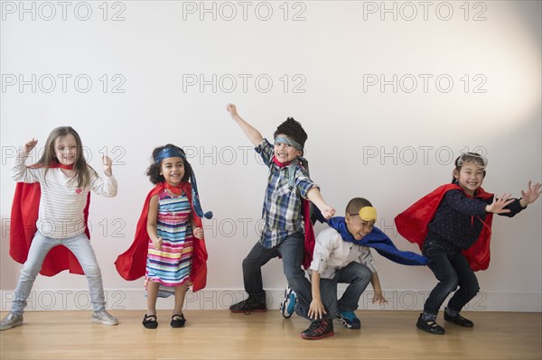 Children playing in capes