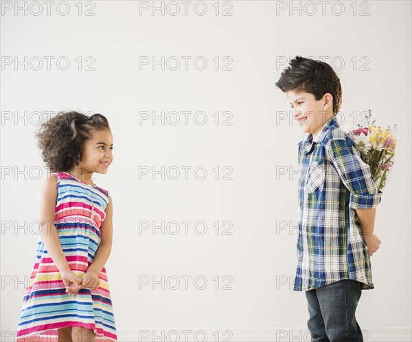 Boy giving girl bouquet of flowers