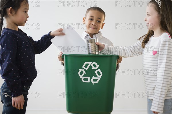 Children recycling together