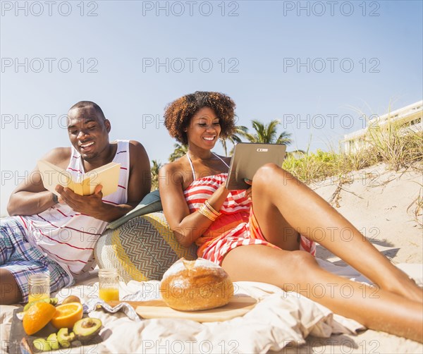 Couple relaxing together on beach