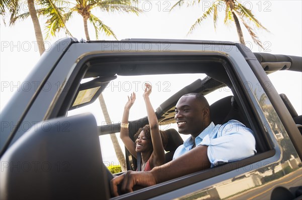 Couple driving together in car