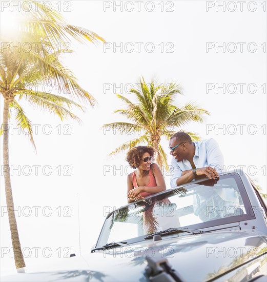 Couple relaxing together in car