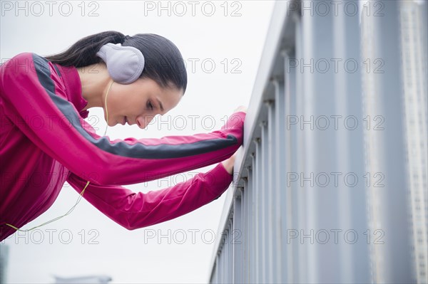 Caucasian woman holding railing