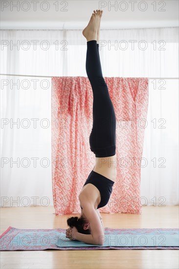 Caucasian woman practicing yoga