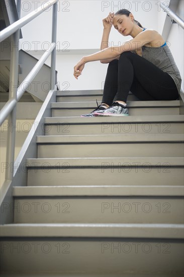 Caucasian woman resting after exercise