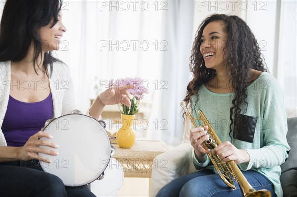 Mother and daughter playing music together