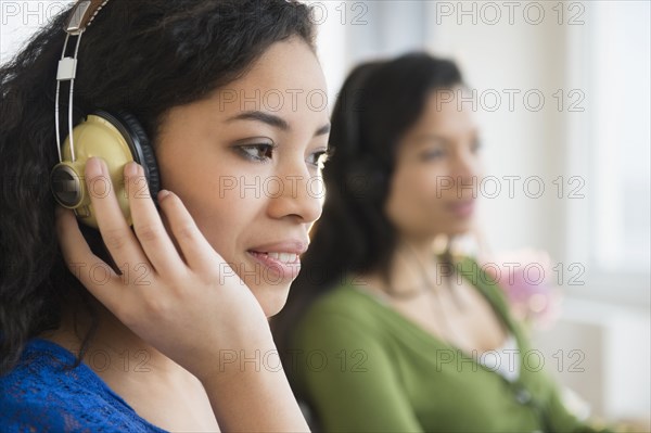 Teenage girl listening to headphones