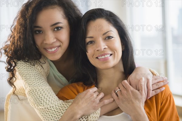 Mother and daughter hugging