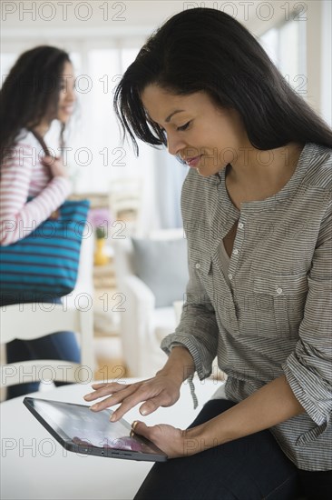 Woman using tablet computer