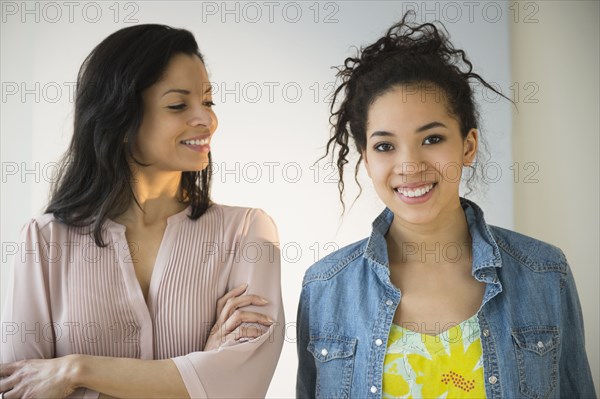 Mother smiling at teenage daughter