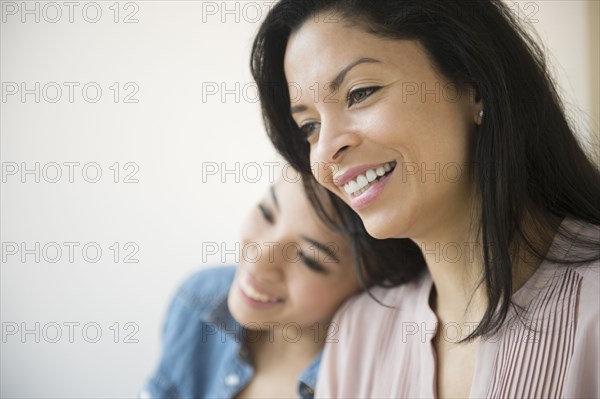 Mother and daughter smiling together