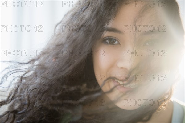 Mixed race teenage girl smiling