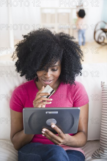 Woman shopping on tablet computer