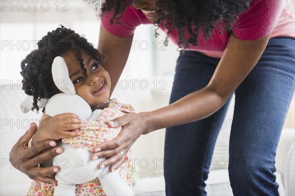 Girl hugging stuffed animal