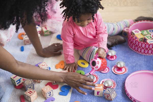 Mother and daughter playing together