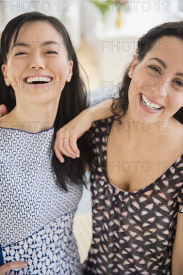 Smiling women standing together