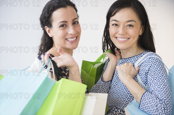 Smiling women shopping together