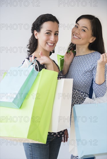 Smiling women shopping together