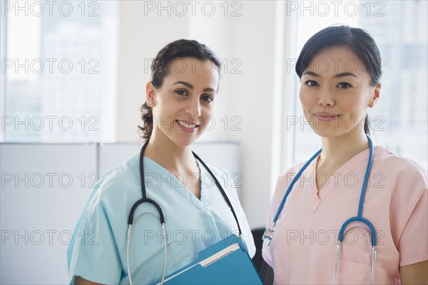 Nurses smiling together in hospital