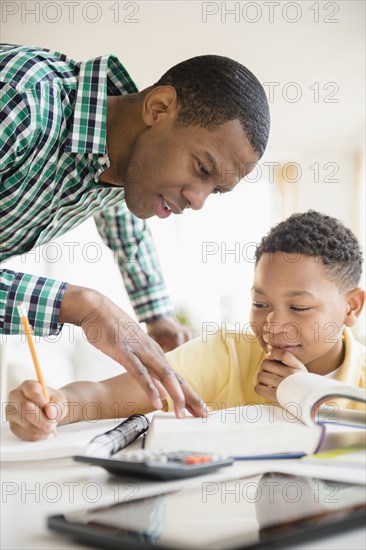 Father helping son with homework