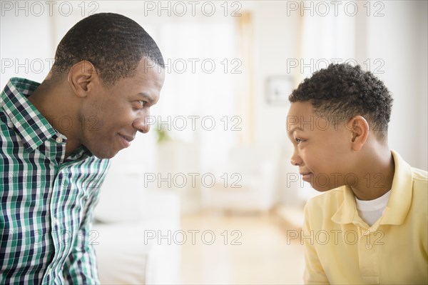 Father and son making faces at each other