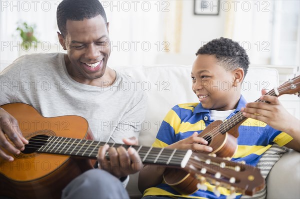 Father and son playing music together