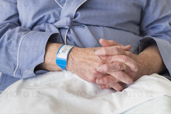 Senior Caucasian man sitting in hospital bed