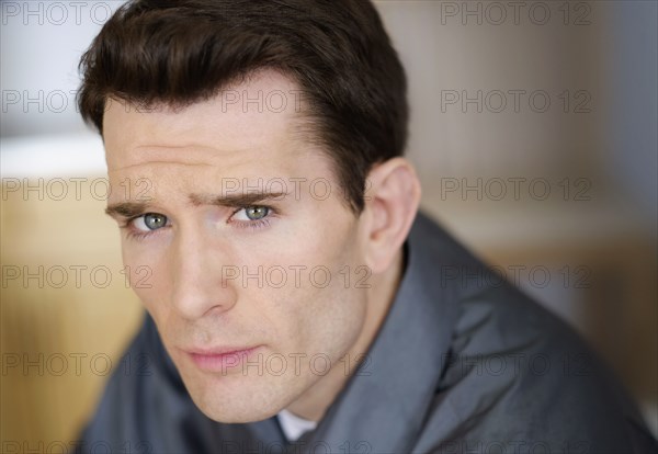 Close up of Caucasian man frowning
