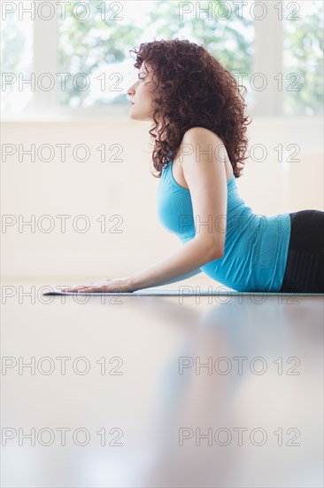 Hispanic woman practicing yoga