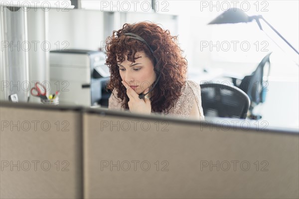 Hispanic businesswoman working in office