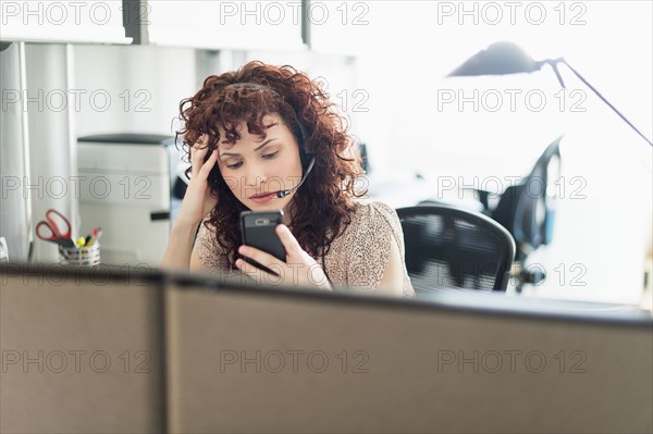 Hispanic businesswoman working in office