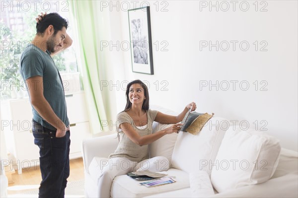 Couple picking out fabric swatches together