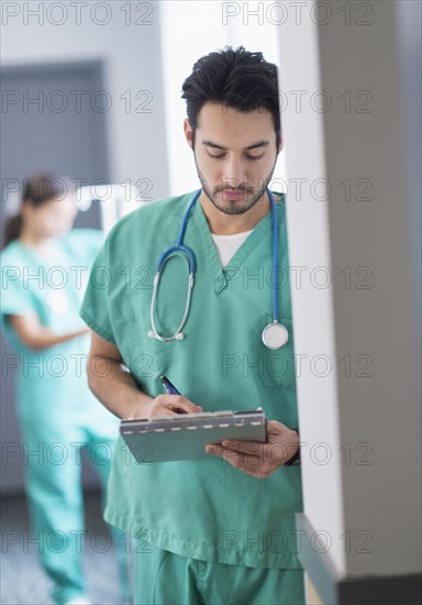 Mixed race nurse working in hospital