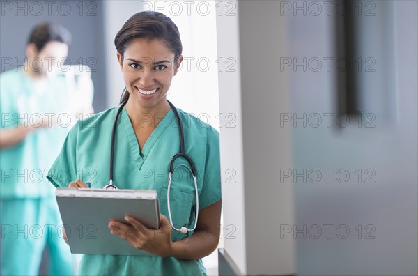 Hispanic nurse working in hospital