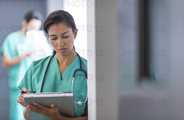 Hispanic nurse working in hospital