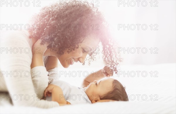 Mixed race mother admiring baby