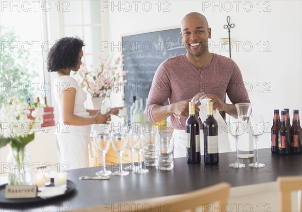 Black bartender smiling in restaurant