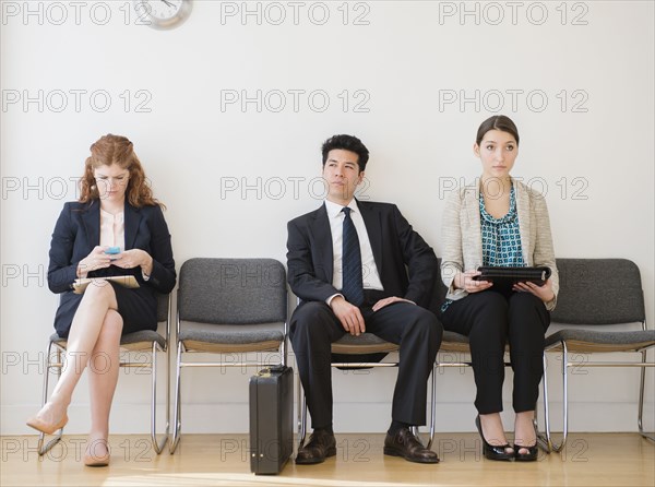 Business people in office waiting room