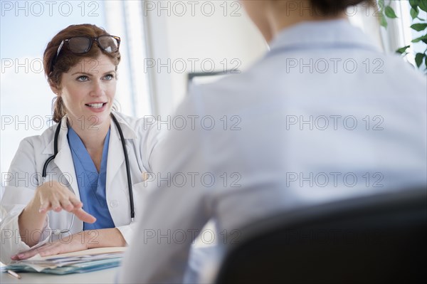 Doctor and patient talking in office